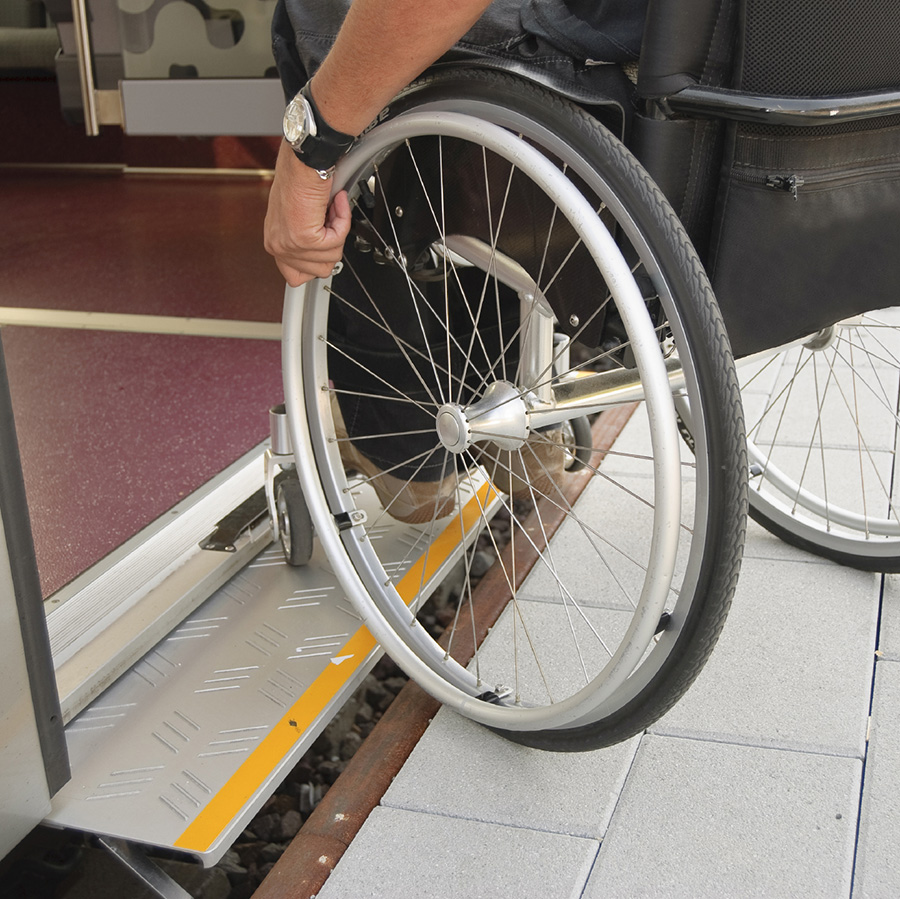 wheelchair user on public transport image
